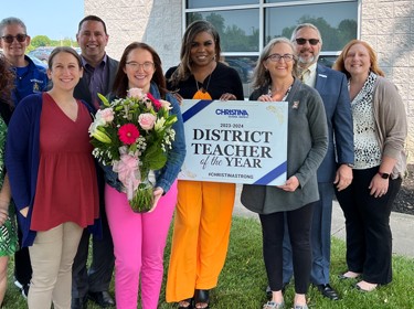 Christina School District's 2023-2024 District Teacher of the Year with administration.